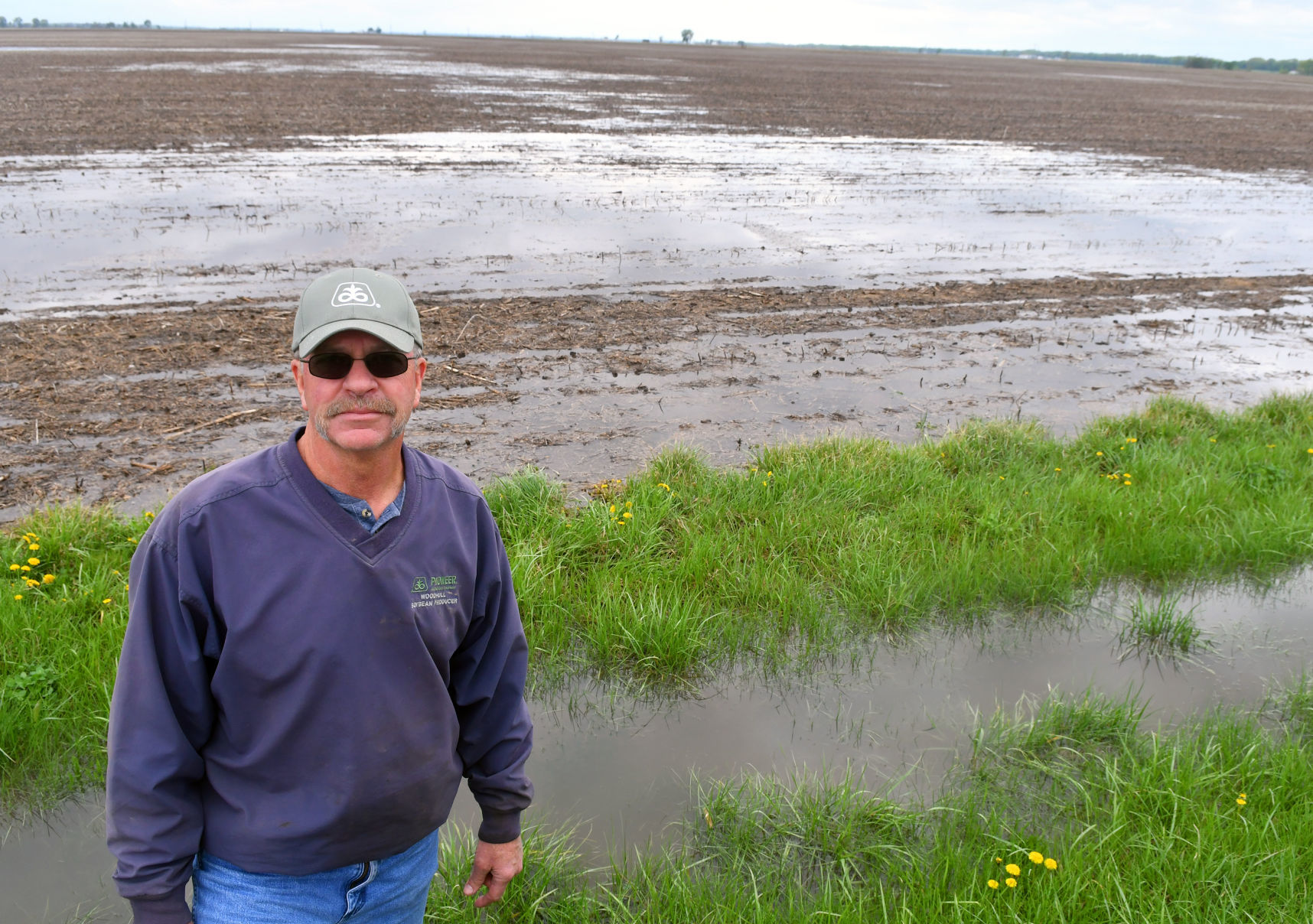 Farmers dealing with flooded fields.